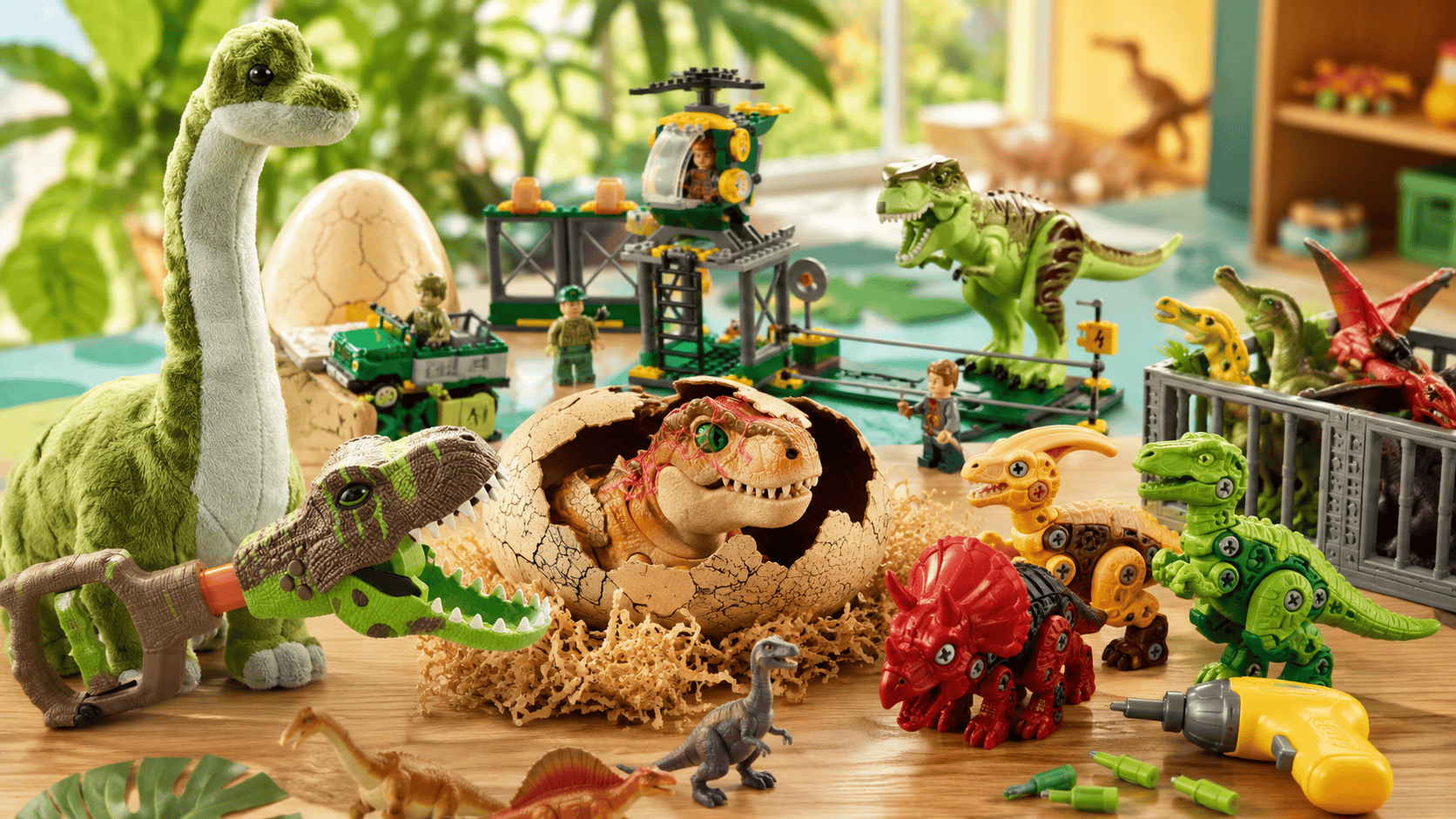 Best dinosaur toys for 5 year olds displayed on a playroom table, including dinosaur figures, plush dinosaurs, building toys, eggs, and active play toys.