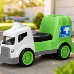 Little Tikes Dirt Diggers garbage truck ride on toys on a sunny driveway with a recycling bin in the background.