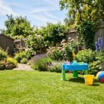 Little Tikes Water Table Review with generic water toys in a sunny backyard