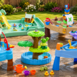 Little Tikes water tables set up outdoors on a sunny backyard patio with water and play accessories