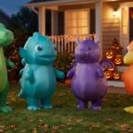 inflatable halloween costumes for kids displayed in a festive front yard with generic dinosaur, fantasy animal and bird designs